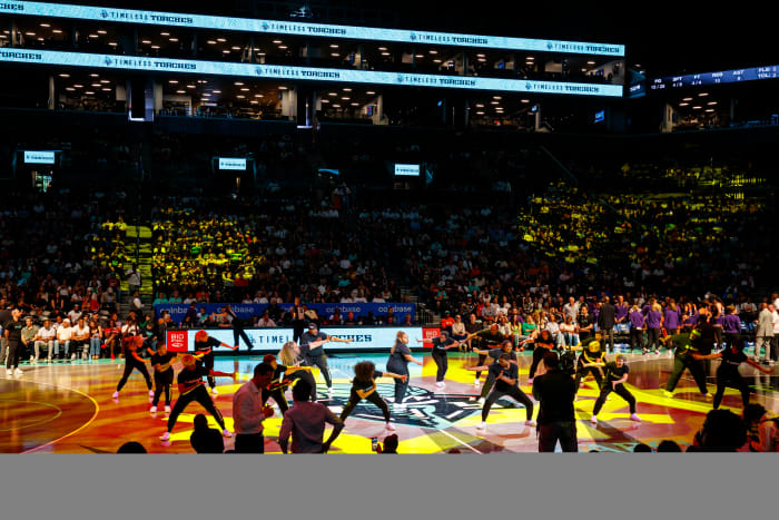 A shot from the crowd as the New York Liberty's dance squad the Timeless Torches perform on the court.